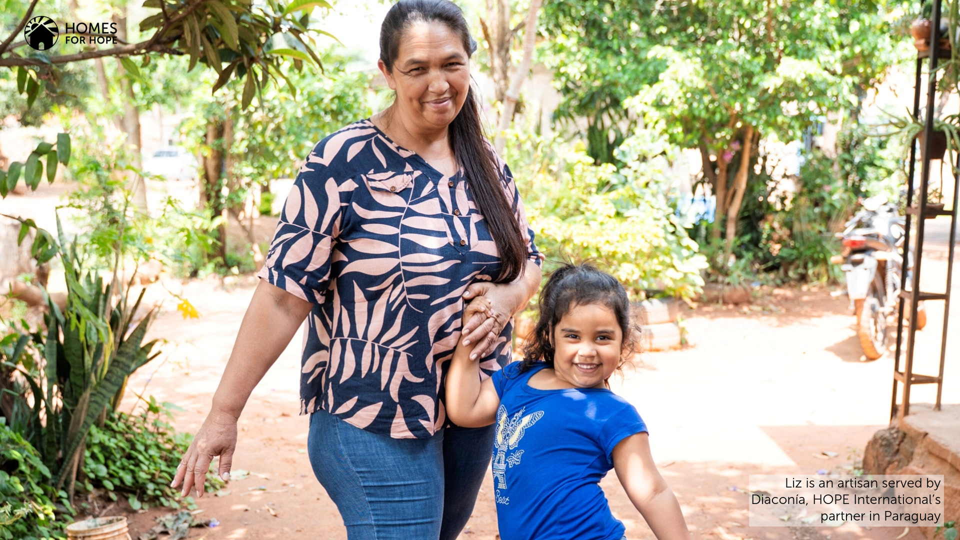Photo shows Liz smiling with her granddaughter