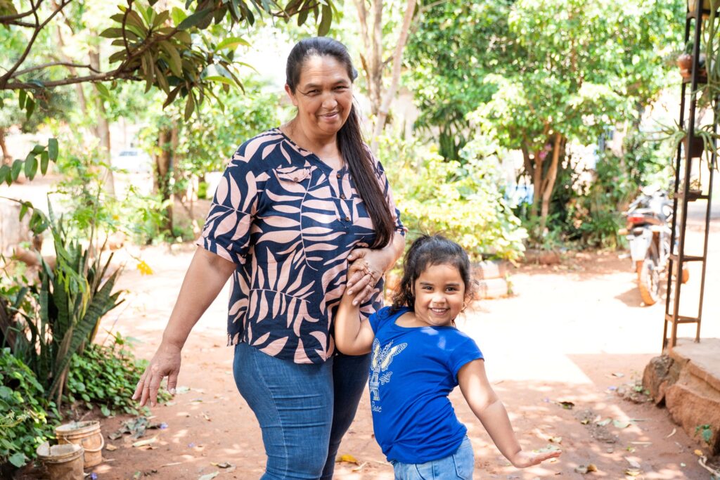 Photo shows Liz smiling with her granddaughter