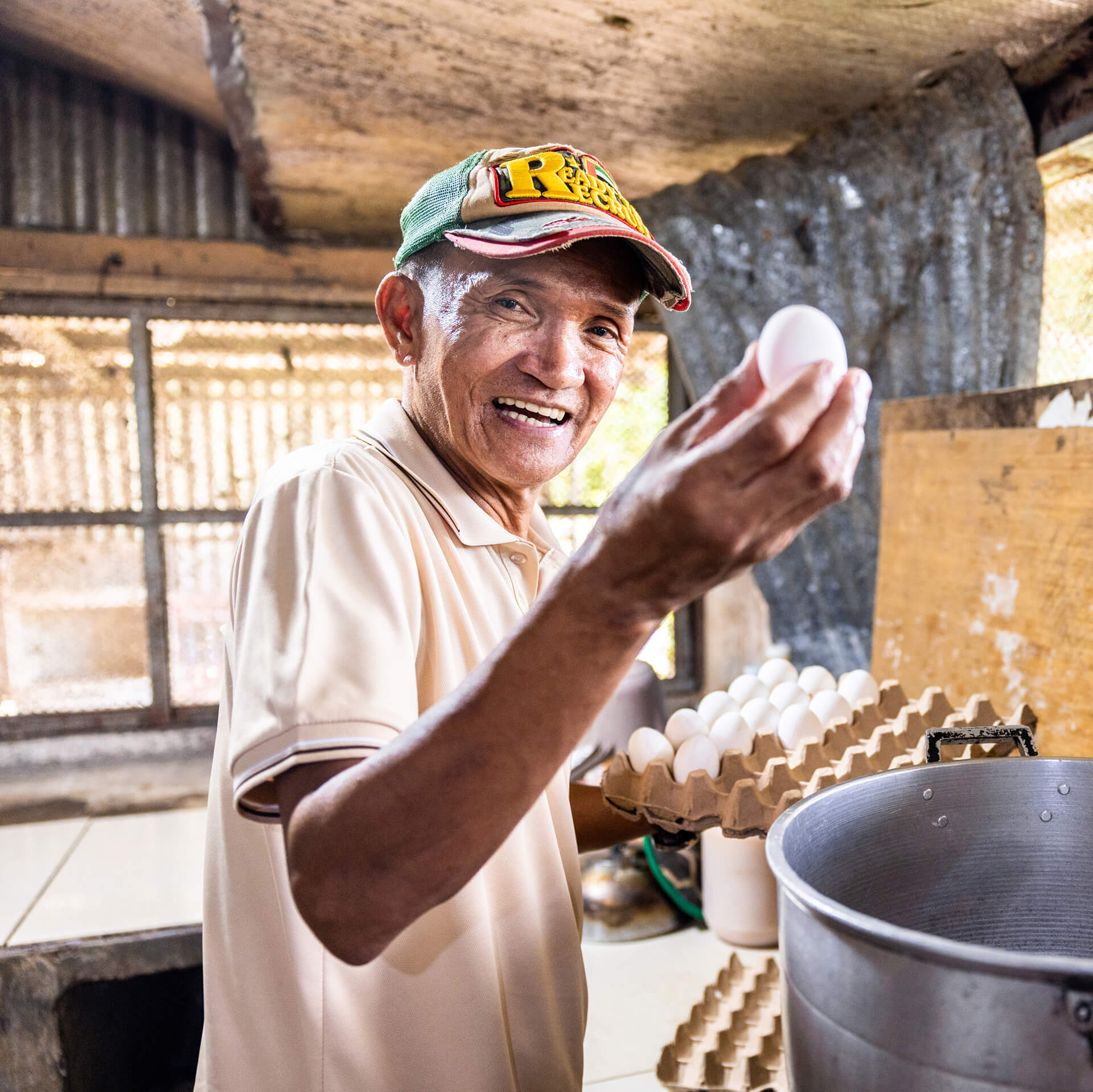 Edgar Dela Cruz smiling at work in the Philippines